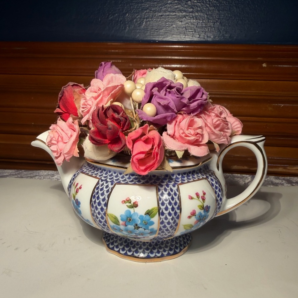 Vintage ceramic "Blue Garland" porcelain teapot filled with Faux roses